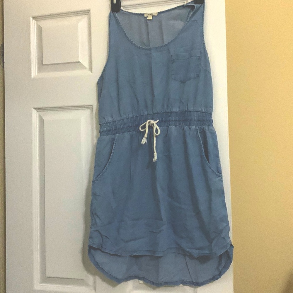 The brand is Timing size Large. It does run small. It’s very light denim.